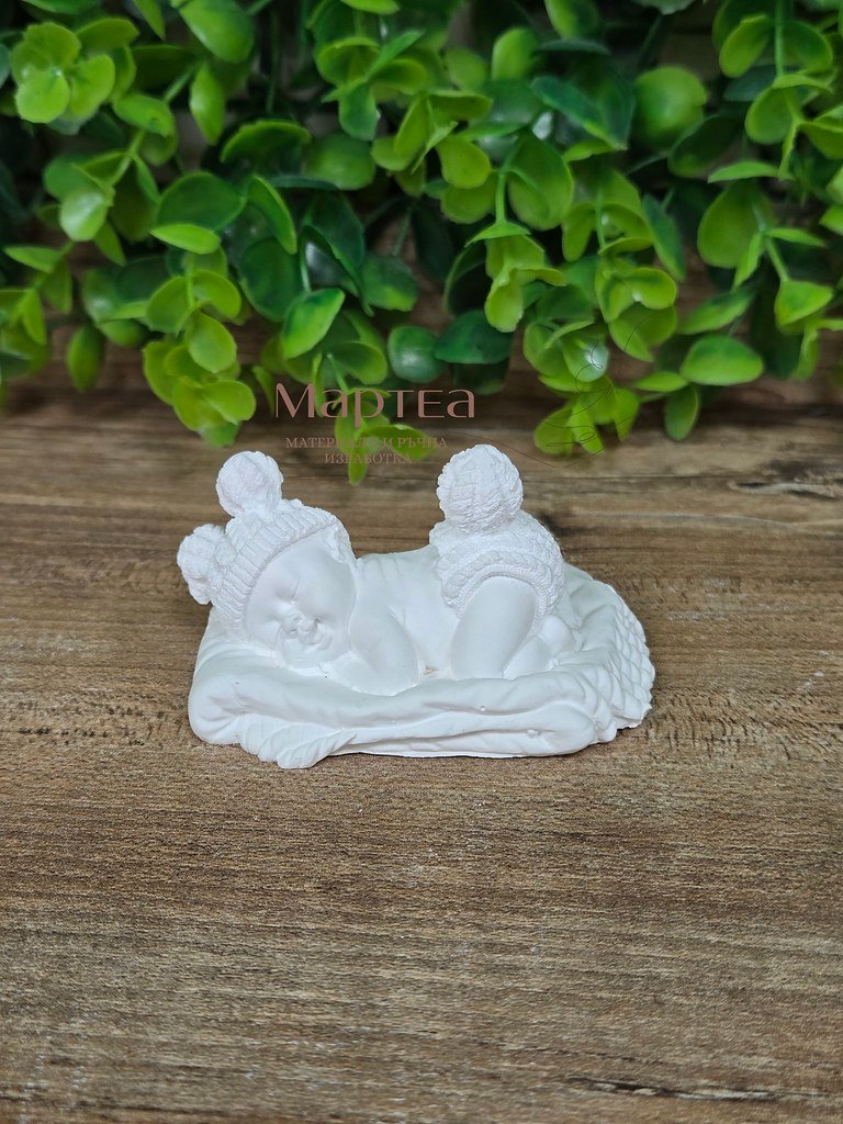 plaster baby on a pillow