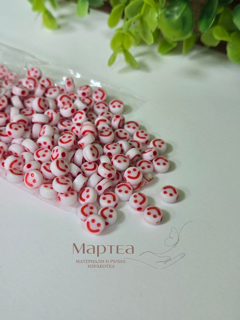beaded red and white smiley faces